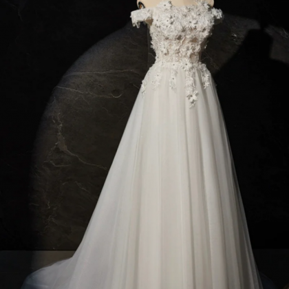 White A Line Off The Shoulder Flowers And Tulle..